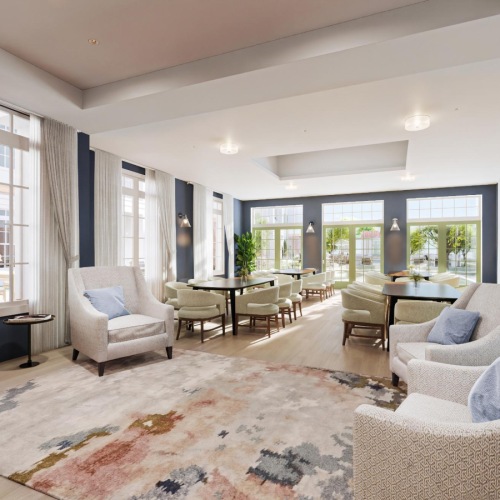 a well-lit lounge area with a large sofa