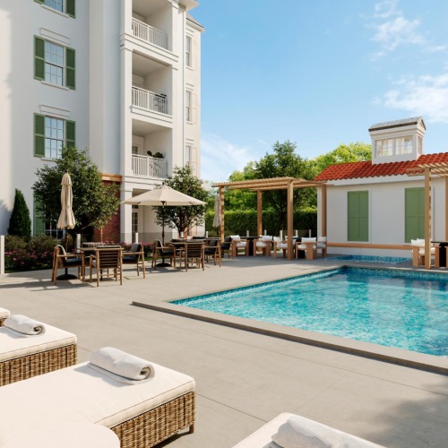 Resort-style swimming pool with lounge seating