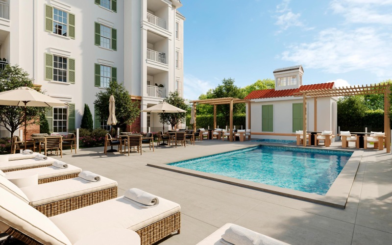 Resort-style swimming pool with lounge seating