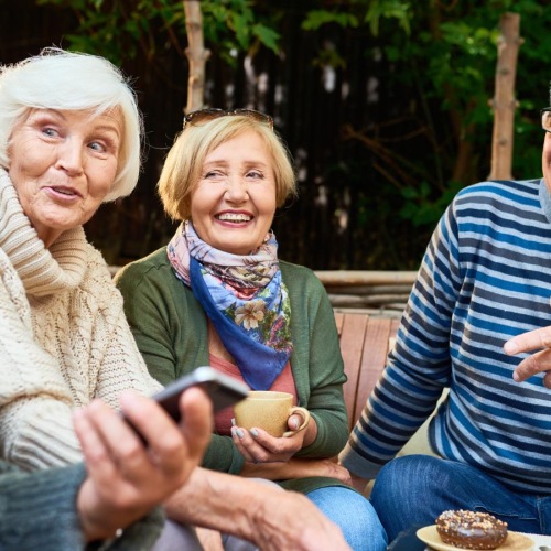 a group of people sitting outside