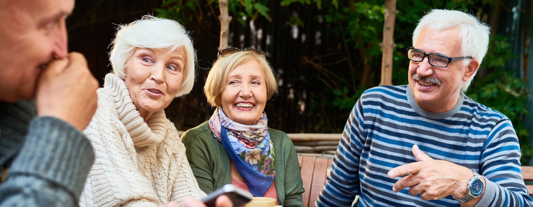 a group of people sitting outside