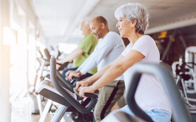 a few people exercising in a gym